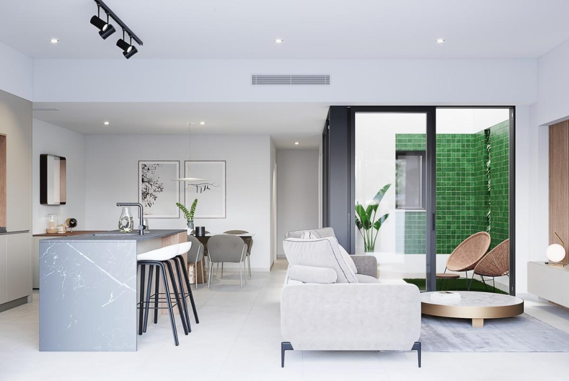 Bright modern open-plan living room and kitchen in a sleek 3-bedroom ground floor home with private garden in Costa Blanca.