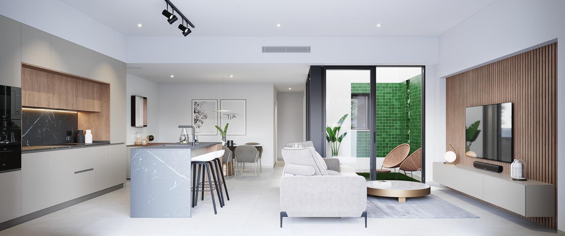 Bright modern open-plan living room and kitchen in a sleek 3-bedroom ground floor home with private garden in Costa Blanca.