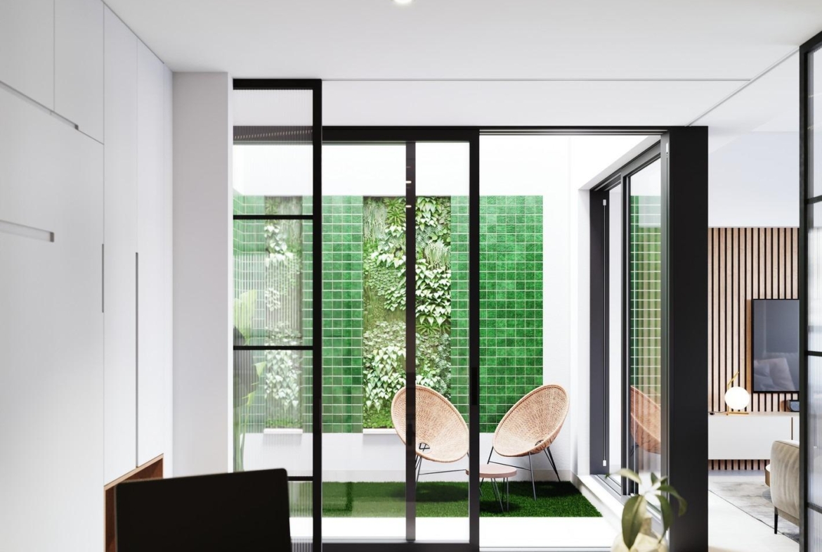 Bright modern ground floor home in Pilar de la Horadada with sleek indoor workspace opening to a vibrant green tiled...