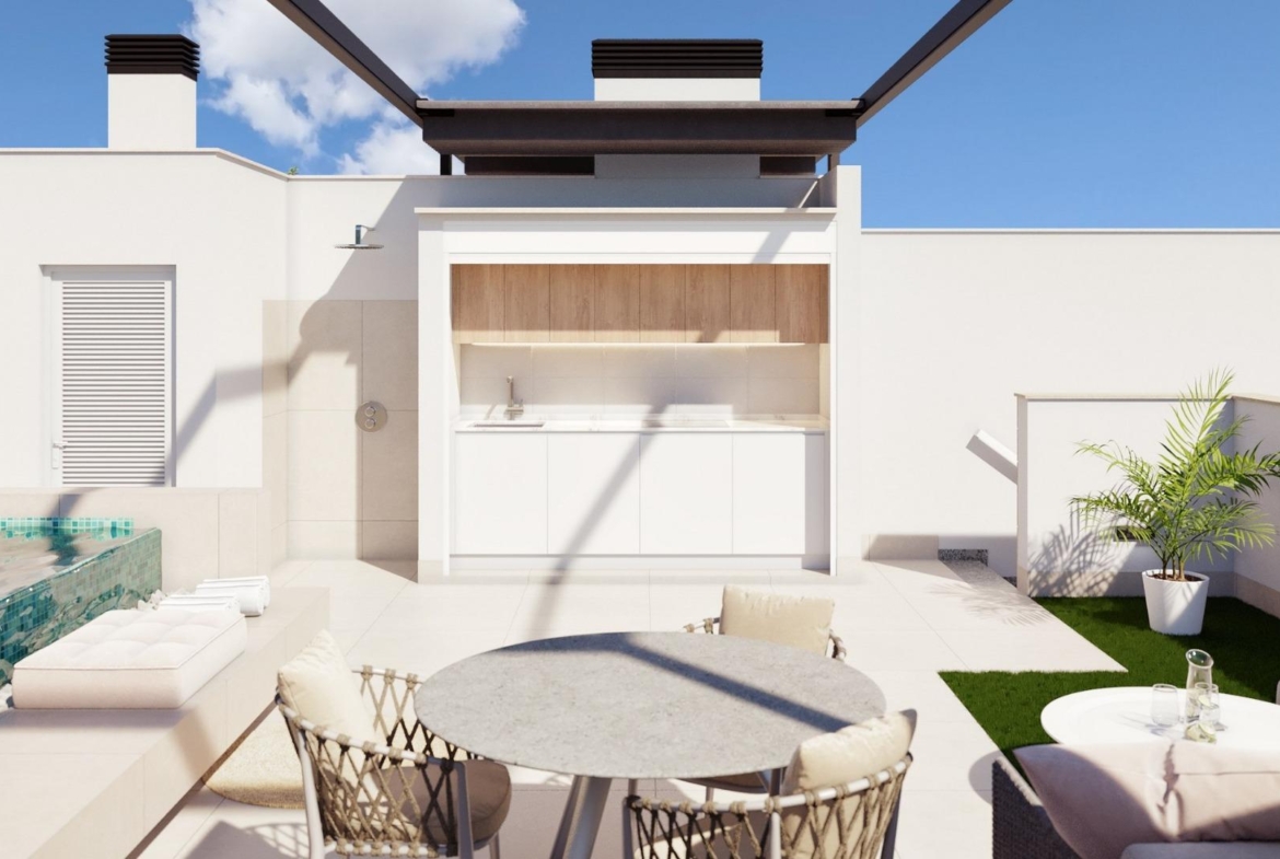 Sun-drenched modern ground floor home terrace in Pilar de la Horadada with sleek outdoor kitchen, seating, and private...