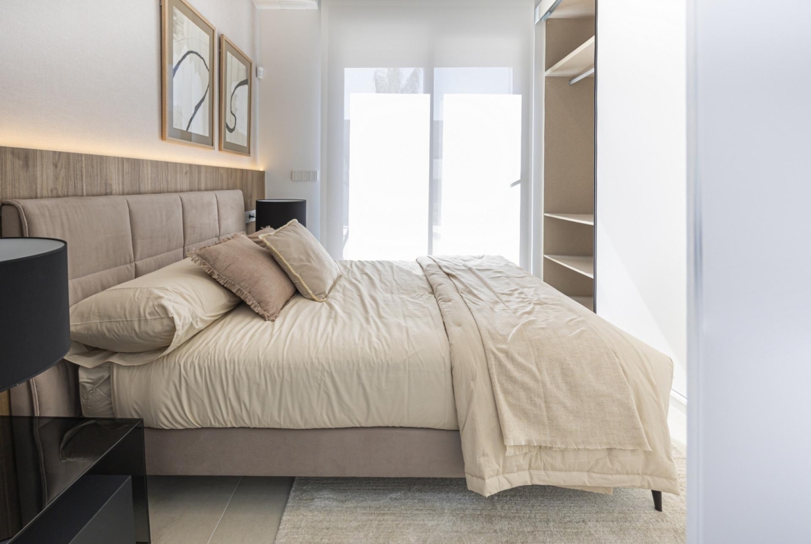 Bright and modern bedroom in bespoke 3-bedroom villa in Ciudad Quesada, Costa Blanca, with elegant neutral tones and soft...