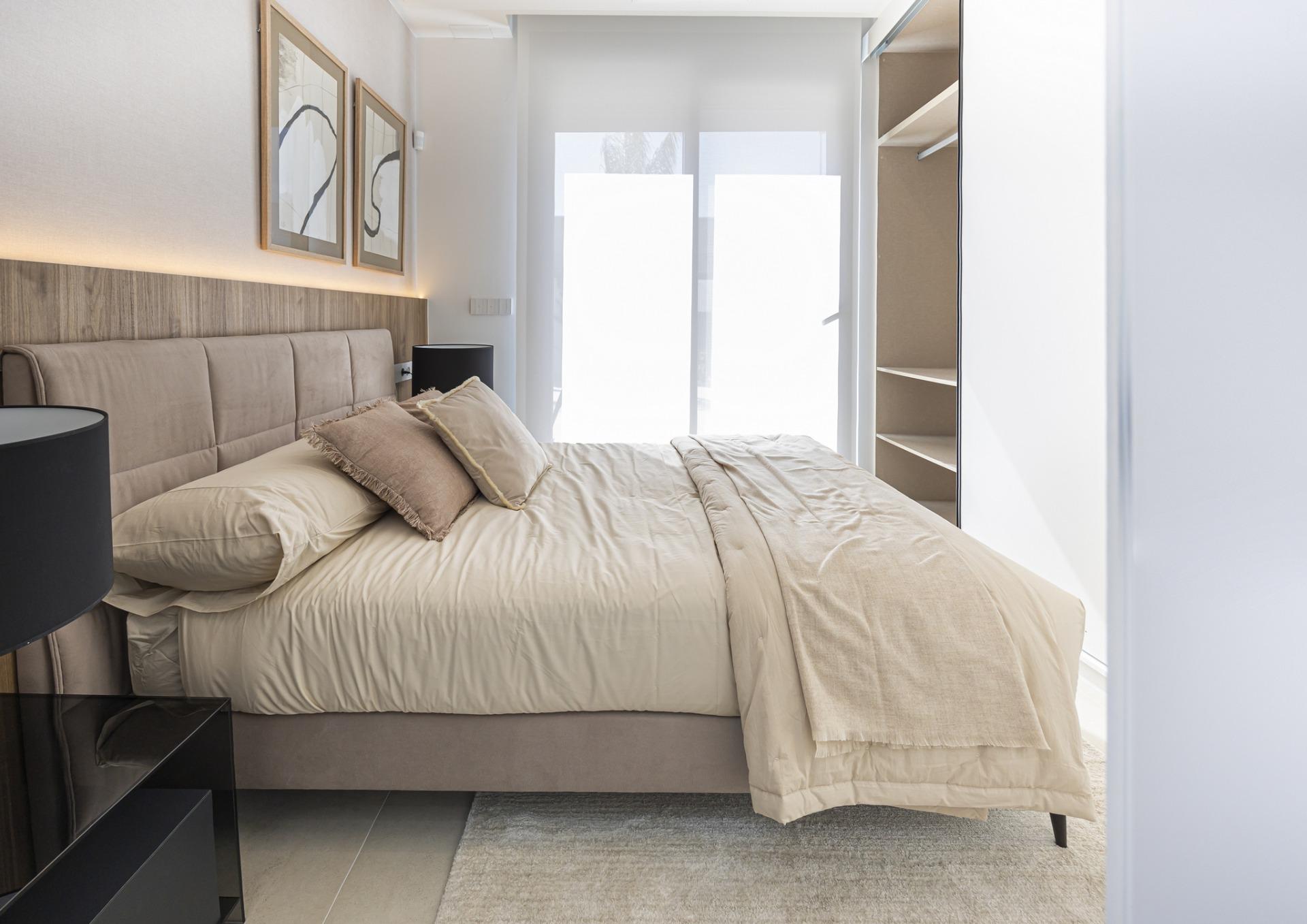 Bright and modern bedroom in bespoke 3-bedroom villa in Ciudad Quesada, Costa Blanca, with elegant neutral tones and soft...