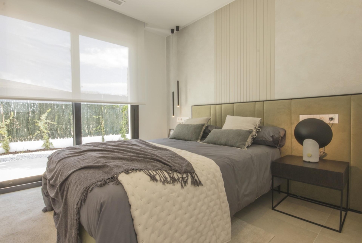 Bright and serene bedroom in a bespoke 3-bedroom villa in Ciudad Quesada, featuring soft earthy tones and modern décor.