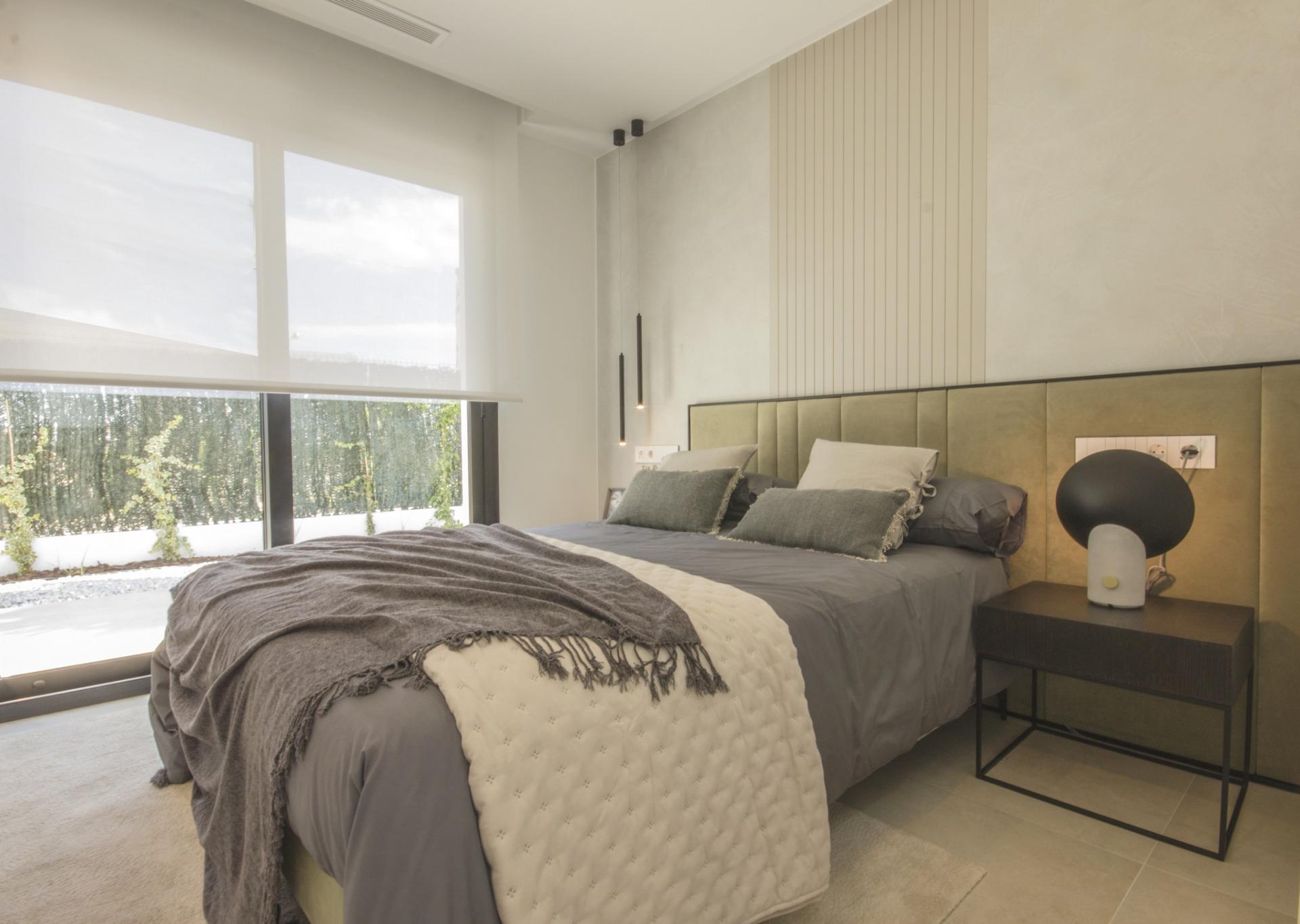 Bright and serene bedroom in a bespoke 3-bedroom villa in Ciudad Quesada, featuring soft earthy tones and modern décor.