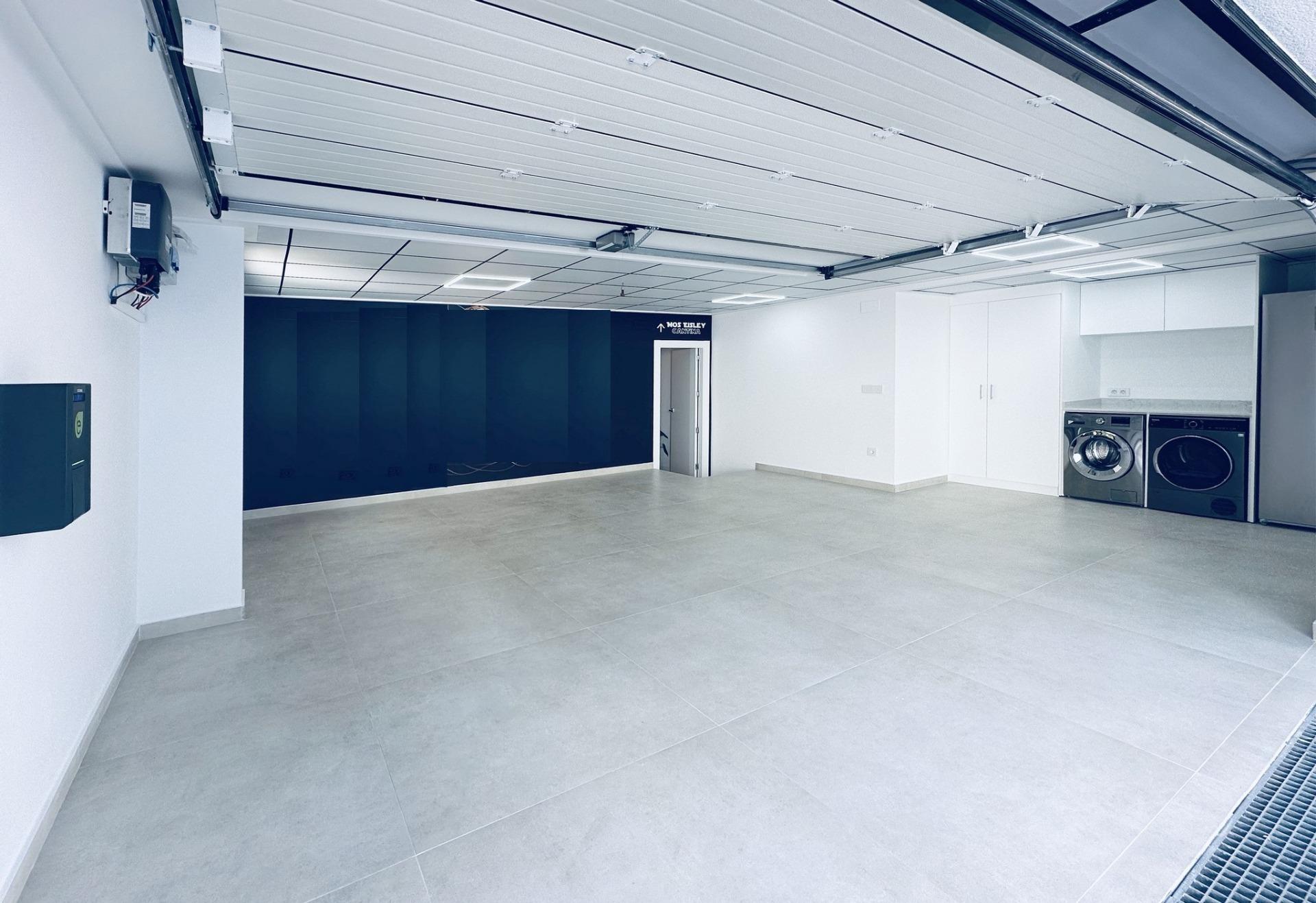 Spacious, sleek garage in bespoke new build 3-bedroom villa with modern laundry area in Ciudad Quesada, Costa Blanca