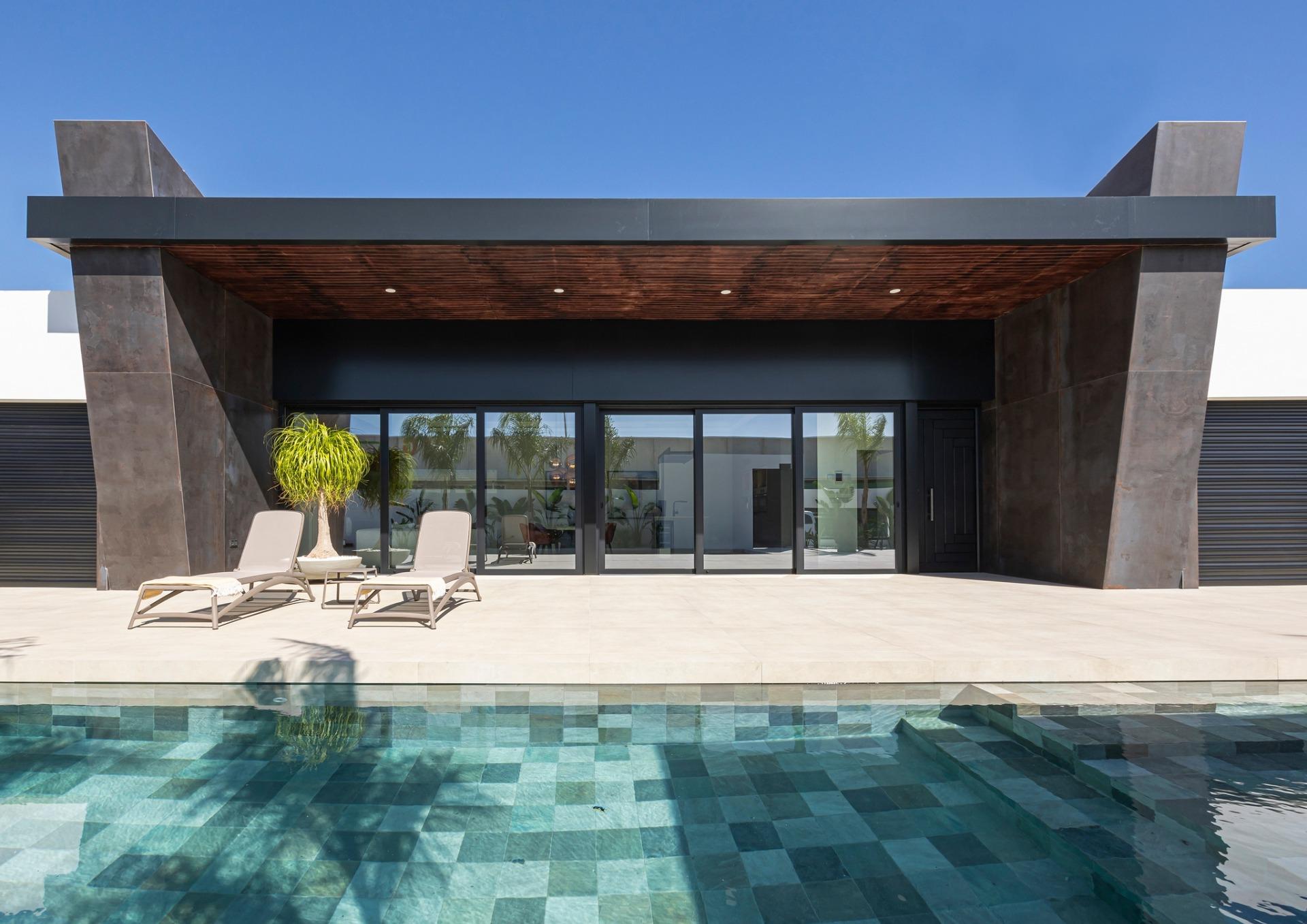 Modern bespoke villa exterior in Ciudad Quesada with sleek dark columns, wooden ceiling, sunlit terrace, and inviting...