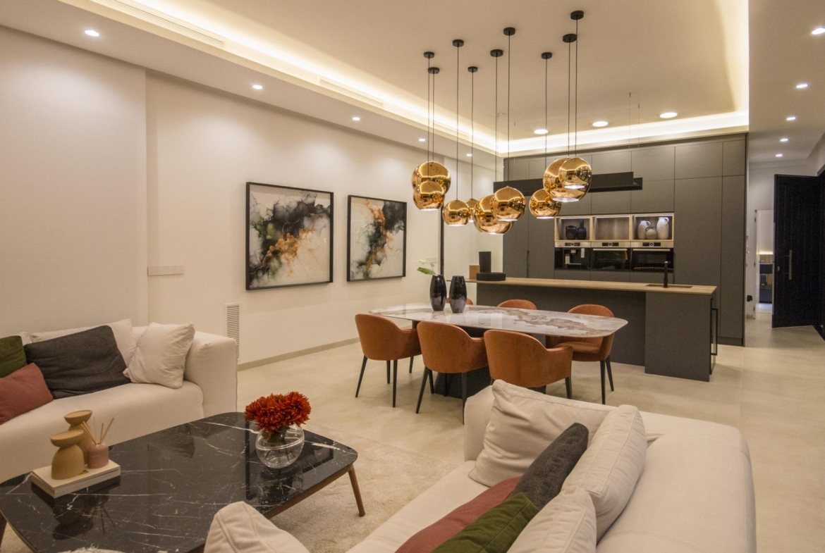 Modern bespoke 3-bedroom villa in Ciudad Quesada with a sleek open-plan kitchen, elegant dining area, and stylish living...