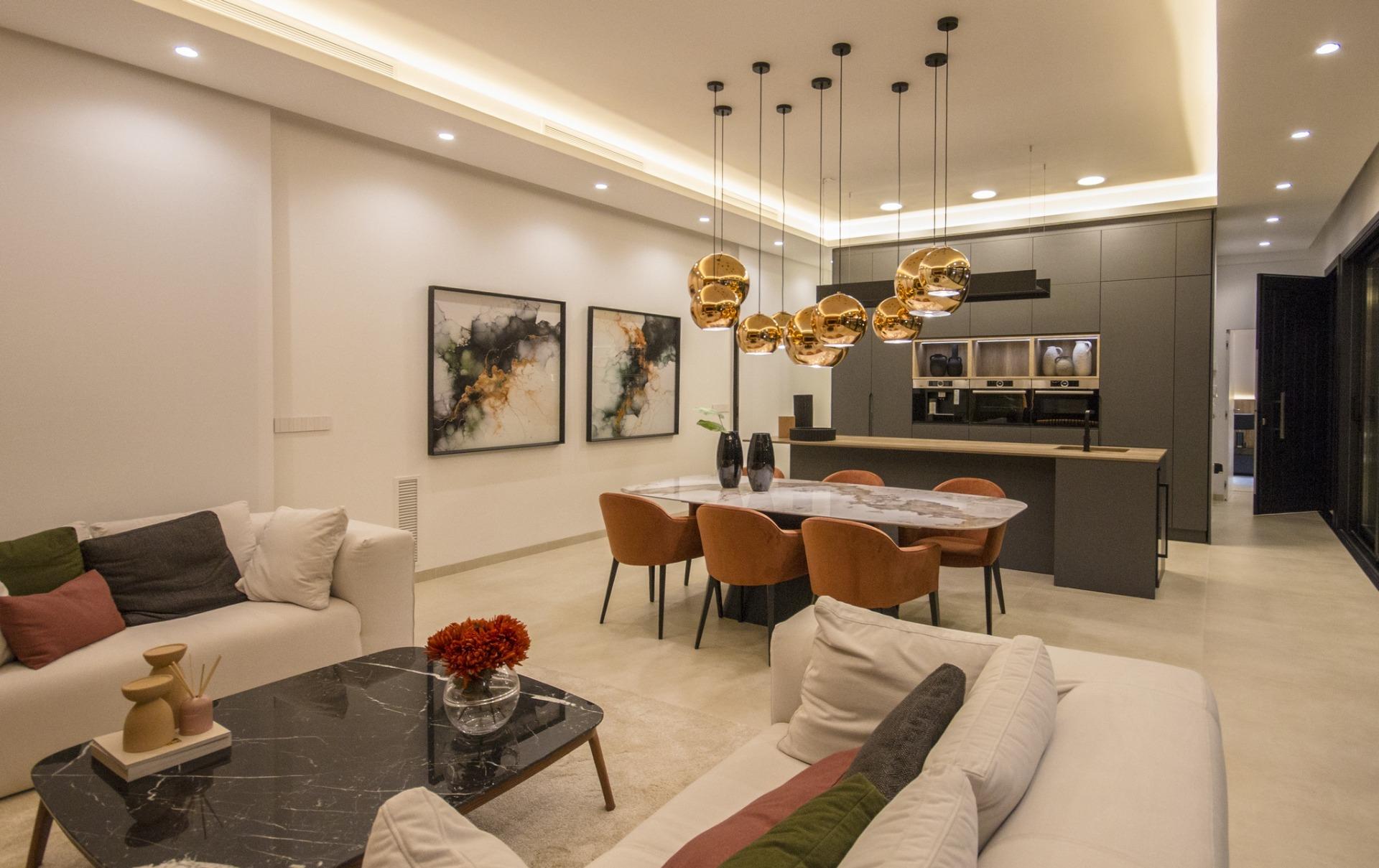Modern bespoke 3-bedroom villa in Ciudad Quesada with a sleek open-plan kitchen, elegant dining area, and stylish living...