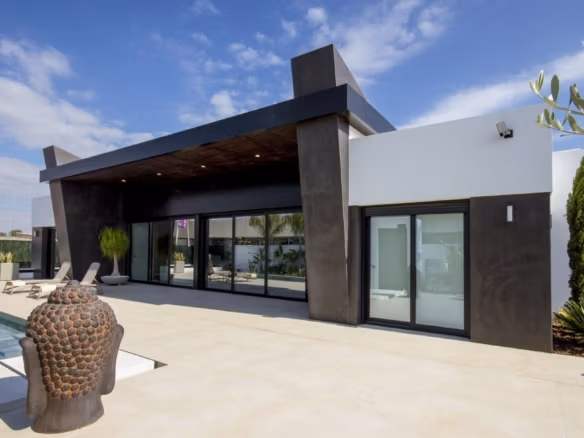Sleek modern 3-bedroom villa in Ciudad Quesada with spacious sun-drenched terrace and private pool surrounded by greenery
