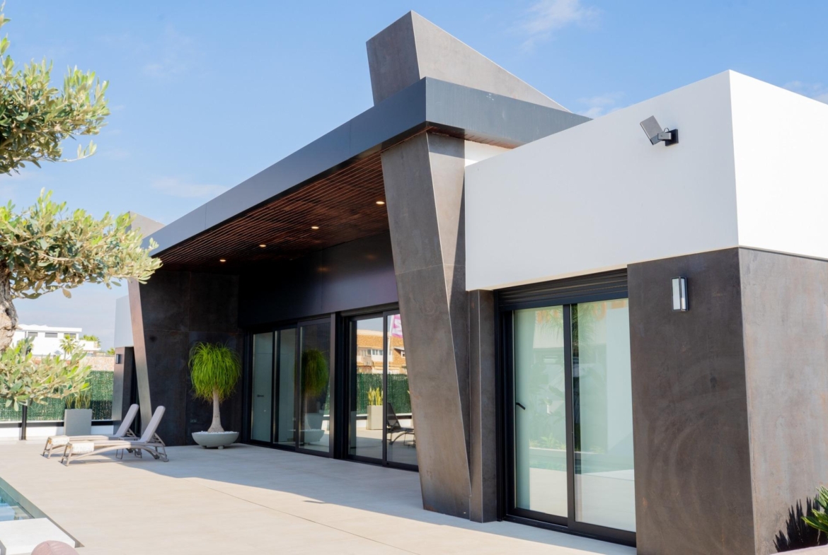 Modern bespoke 3-bedroom villa in Ciudad Quesada with sleek dark accents, floor-to-ceiling glass doors, and sun-drenched...