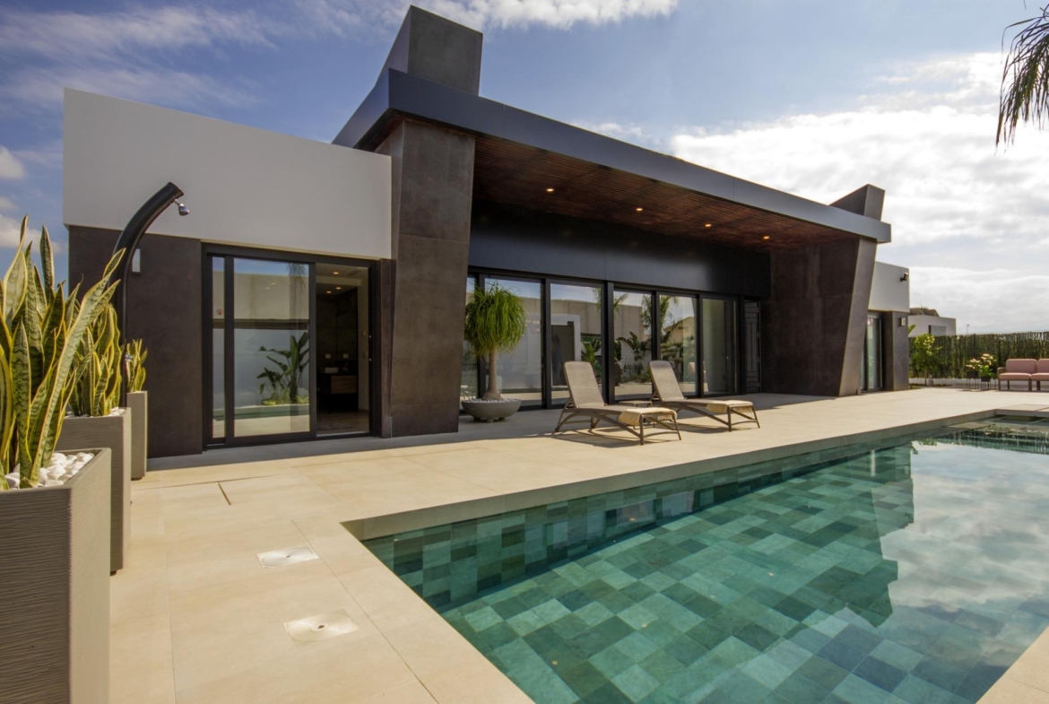 Sleek modern 3-bedroom villa in Ciudad Quesada with spacious sun-drenched terrace, private pool, and lush greenery on...