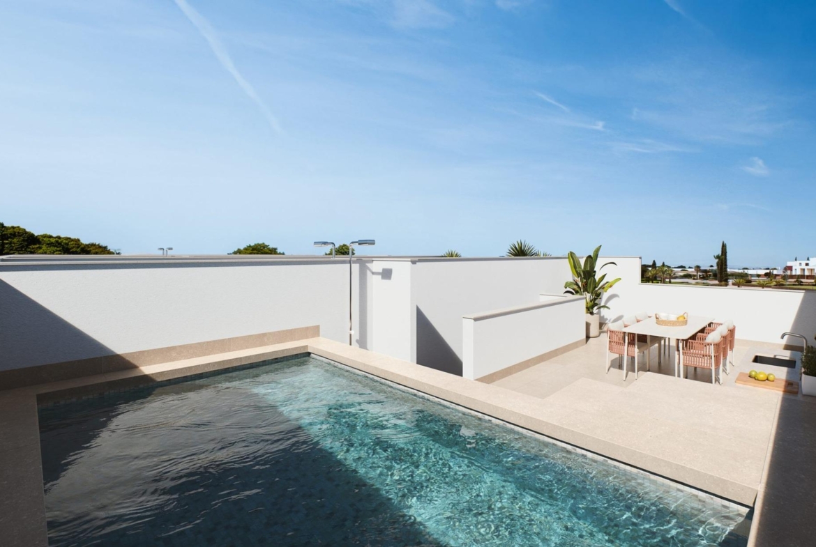 Contemporary-style-townhouses-with-private-swimming-pools-1 Rooftop pool with tiled surround and adjacent dining terrace behind a low wall