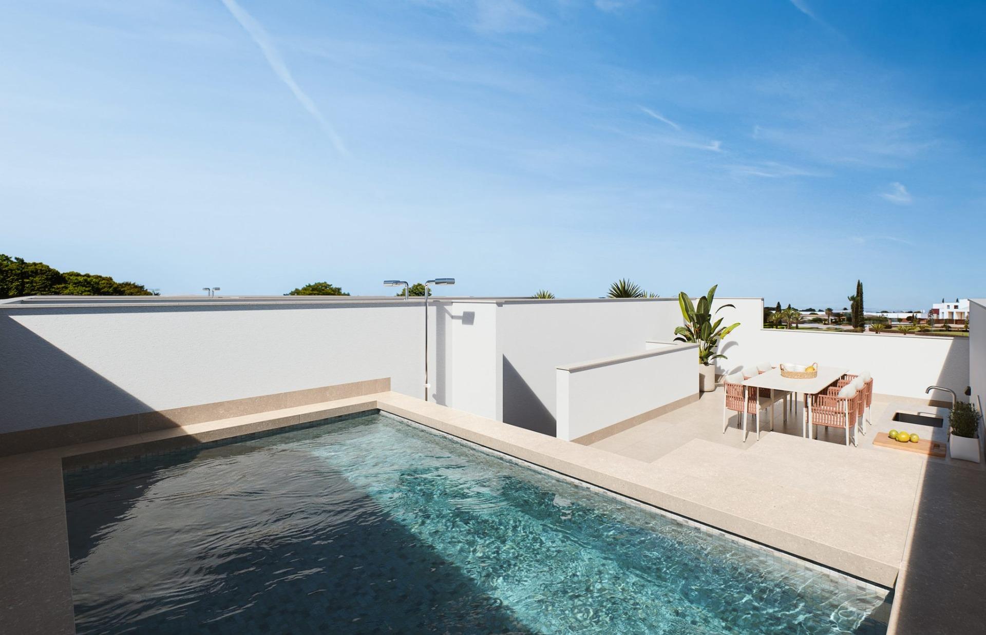 Contemporary-style-townhouses-with-private-swimming-pools-1 Rooftop pool with tiled surround and adjacent dining terrace behind a low wall