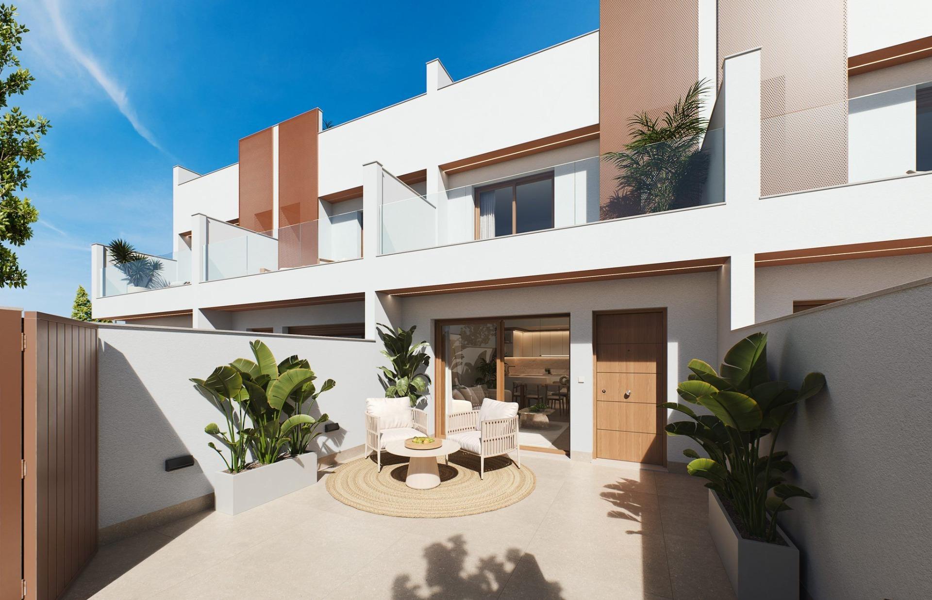Contemporary-style townhouses with private swimming pools Ground-floor patio with rattan seating, potted plants and balcony above