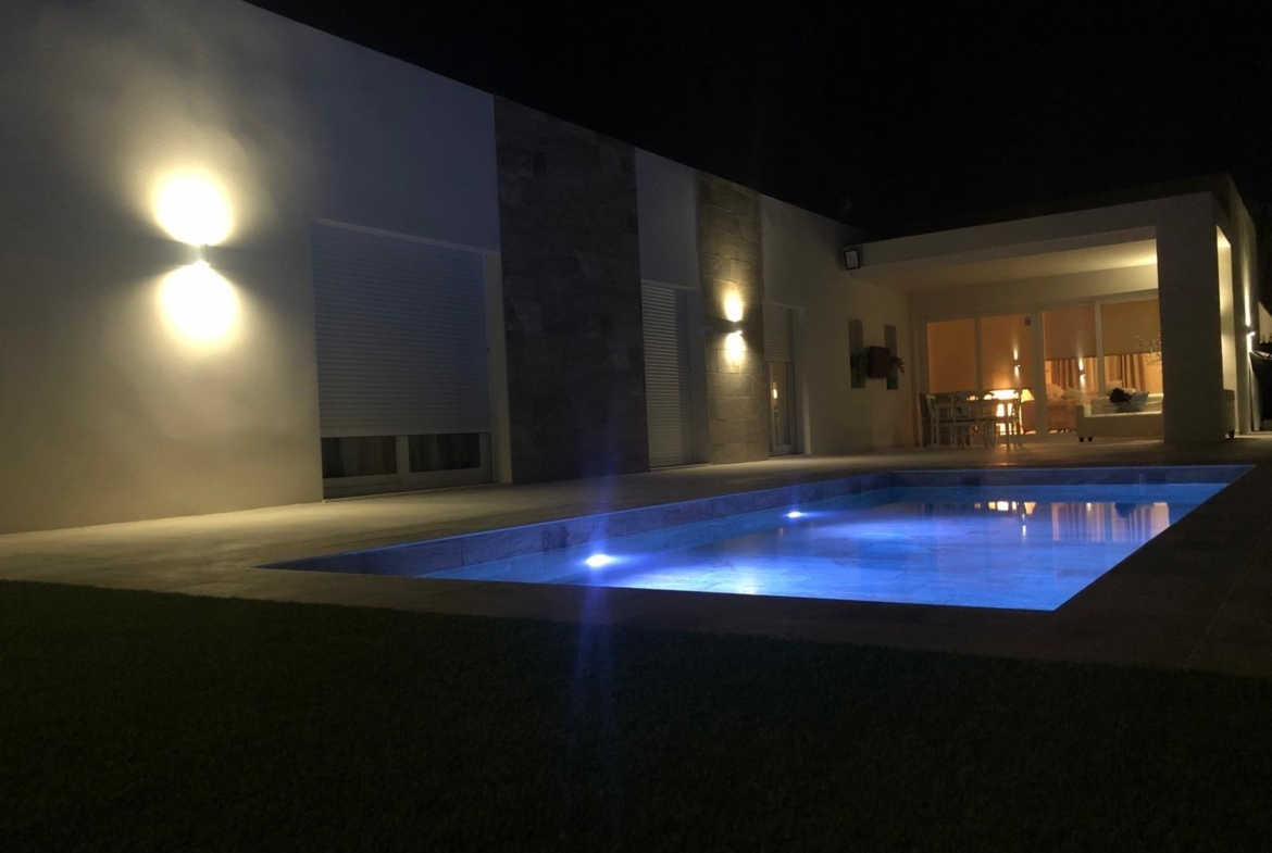 Private pool courtyard at night at a single-storey villa in Pinoso