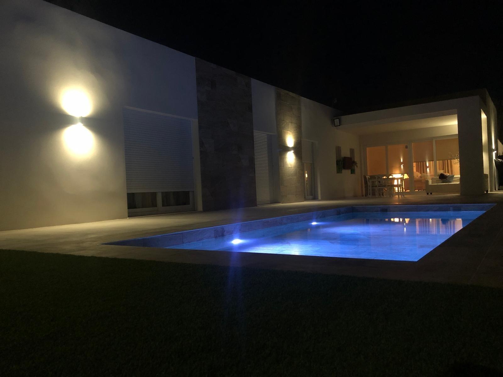 Private pool courtyard at night at a single-storey villa in Pinoso