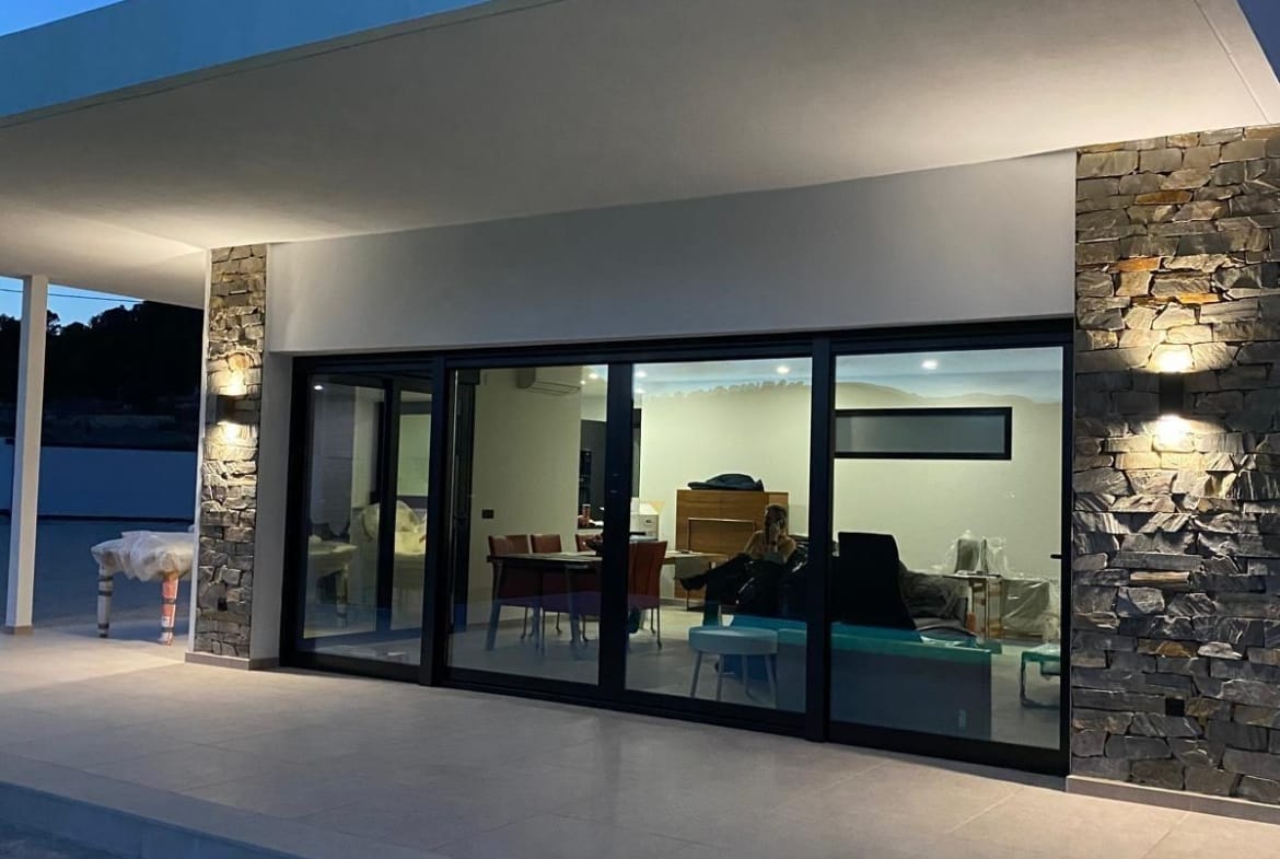 Covered pool terrace at dusk at a Pinoso country villa, Alicante