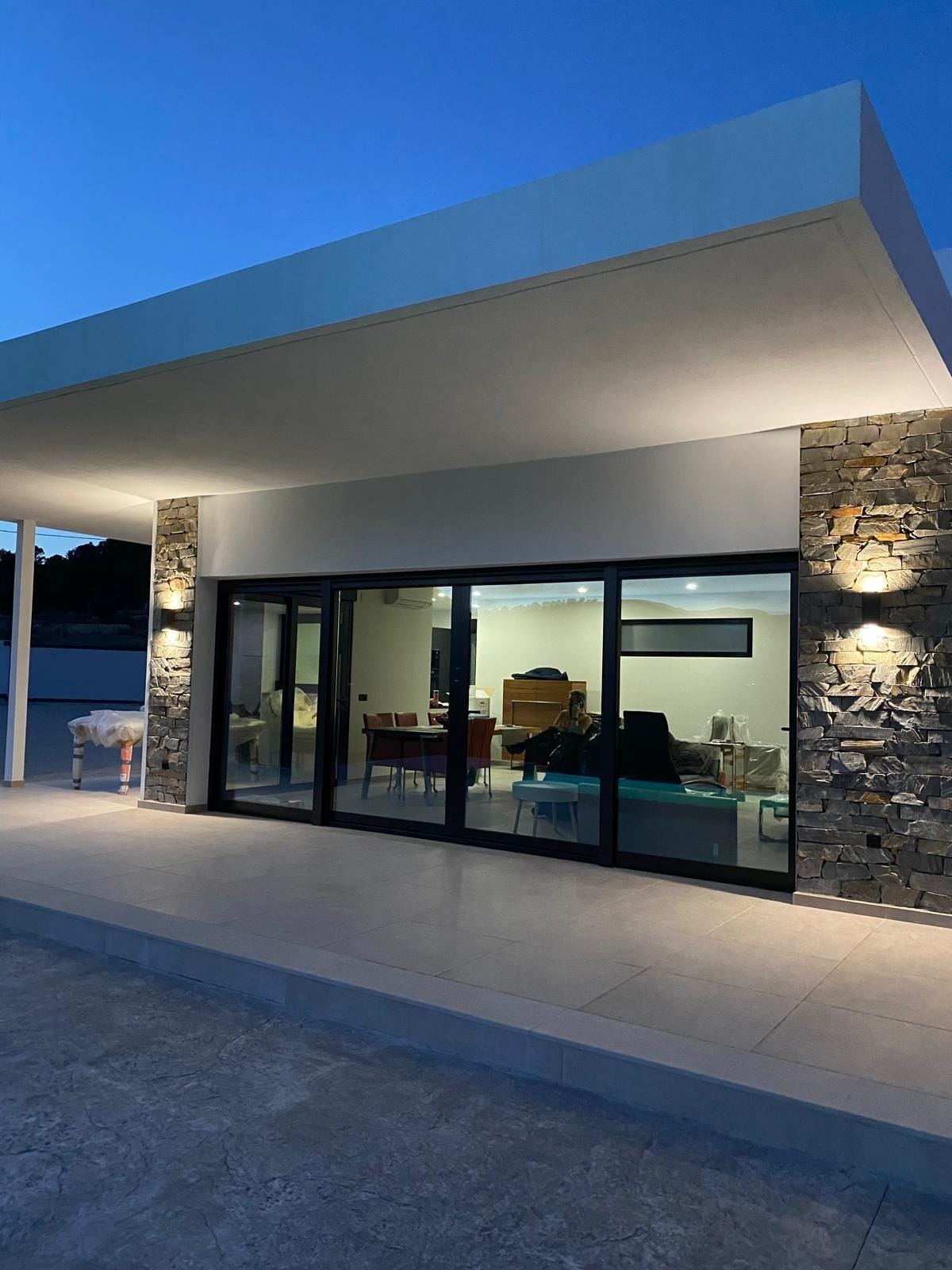 Custom-Built-New-Villas-in-Pinoso-Alicante-Spacious-Homes-in-Natural-Surroundings-16 Covered pool terrace at dusk at a Pinoso country villa, Alicante