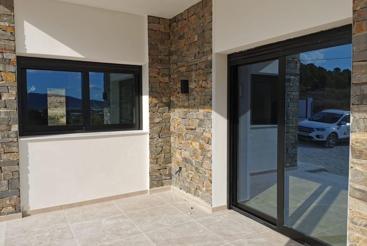Stone-clad entrance porch at a new build villa in Pinoso, Alicante