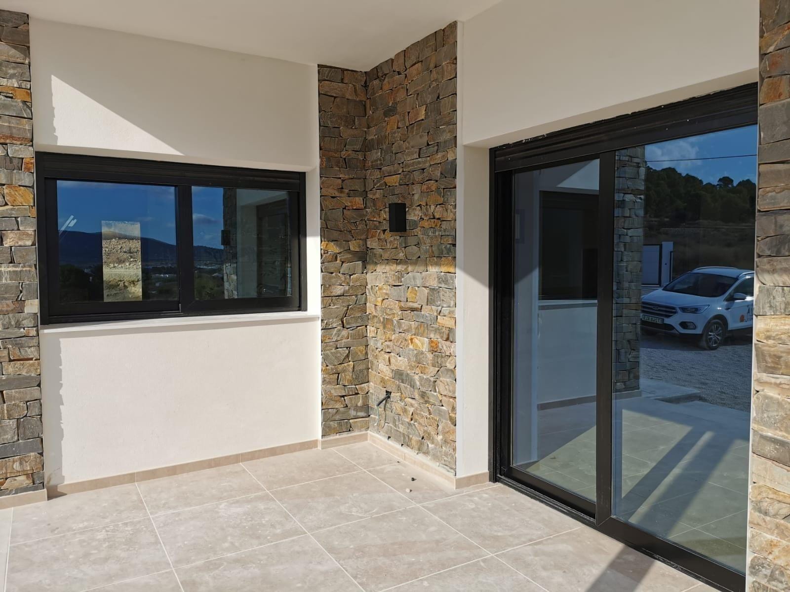 Custom-Built-New-Villas-in-Pinoso-Alicante-Spacious-Homes-in-Natural-Surroundings-17 Stone-clad entrance porch at a new build villa in Pinoso, Alicante