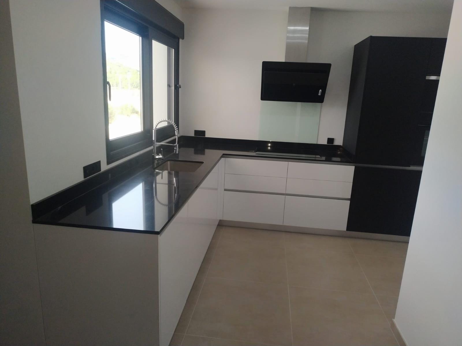 Custom-Built-New-Villas-in-Pinoso-Alicante-Spacious-Homes-in-Natural-Surroundings-18 Fitted kitchen with breakfast bar in a Pinoso country villa, Alicante