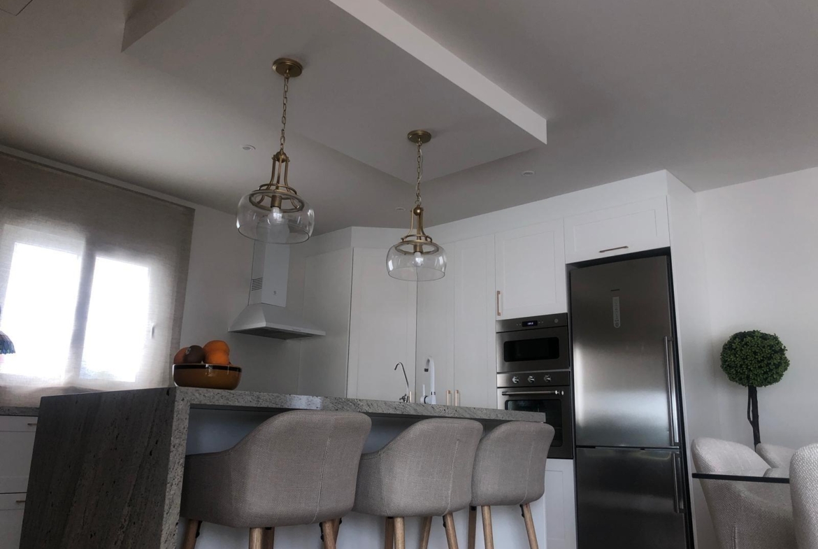 Kitchen island and dining area in a Pinoso country villa
