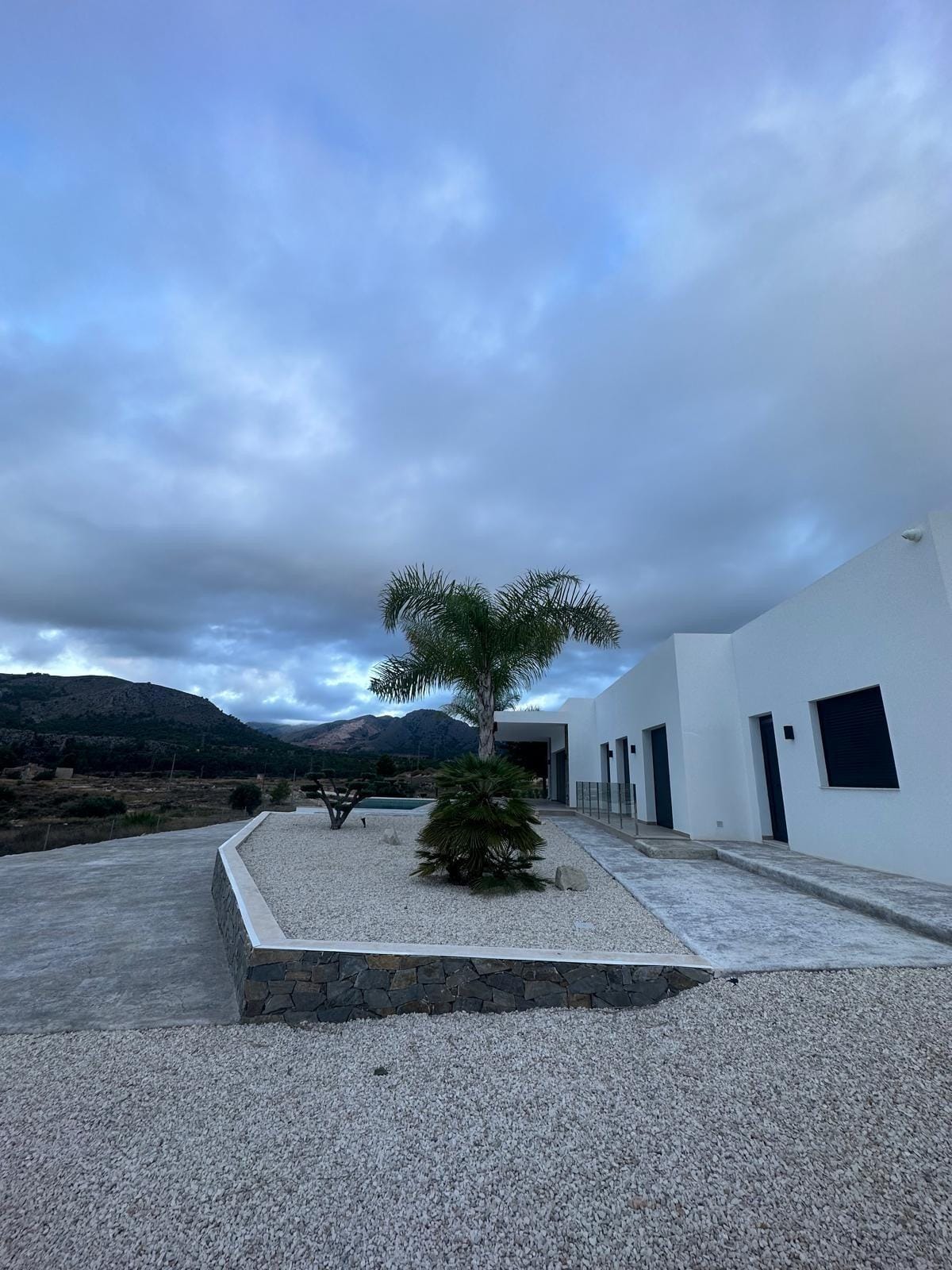 Custom-Built-New-Villas-in-Pinoso-Alicante-Spacious-Homes-in-Natural-Surroundings-28 Side garden and villa exterior in the Pinoso countryside, Alicante