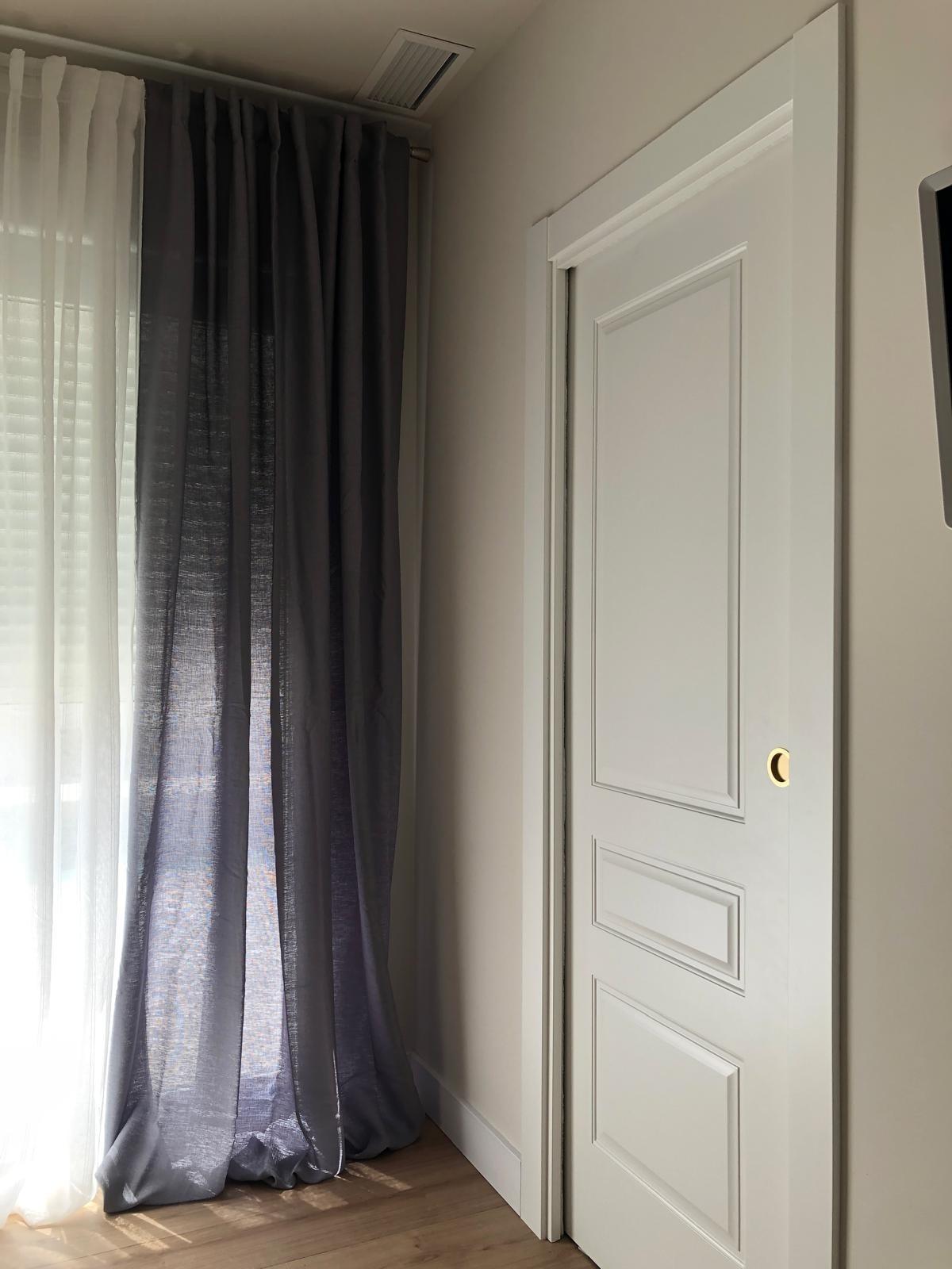 Built-in wardrobe and curtains in a bedroom of a Pinoso villa