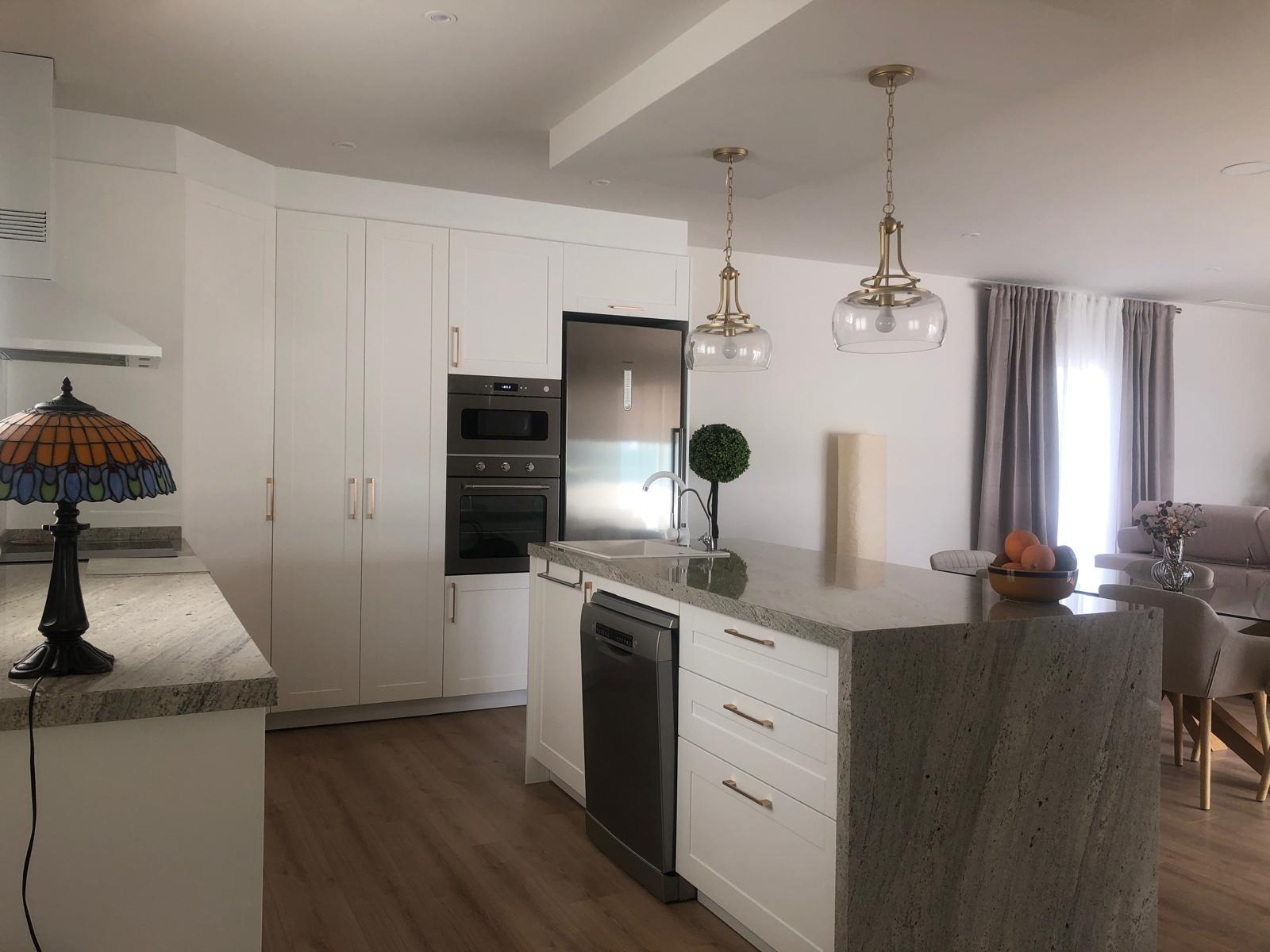 Fitted kitchen and breakfast island in a country villa in Pinoso