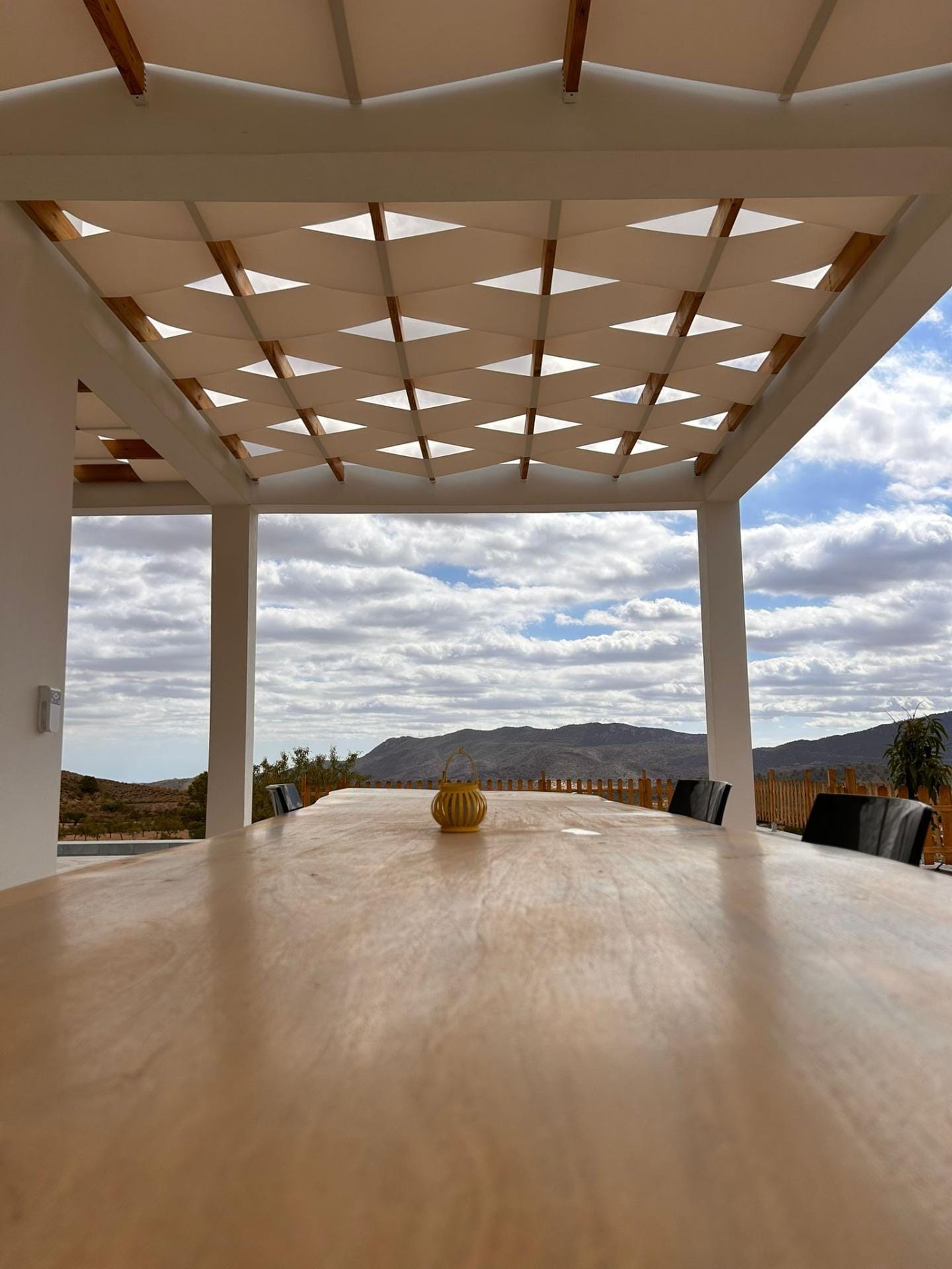 Custom-Built-New-Villas-in-Pinoso-Alicante-Spacious-Homes-in-Natural-Surroundings-31 Outdoor dining table under terrace shade panels in Pinoso, Alicante