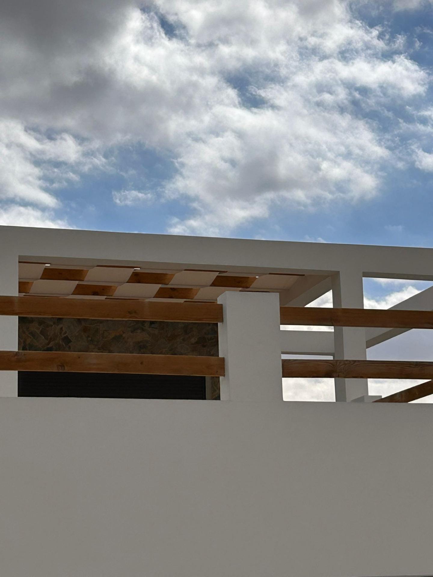 Custom-Built-New-Villas-in-Pinoso-Alicante-Spacious-Homes-in-Natural-Surroundings-35 Upper terrace railing beneath a cloudy sky in Pinoso, Alicante