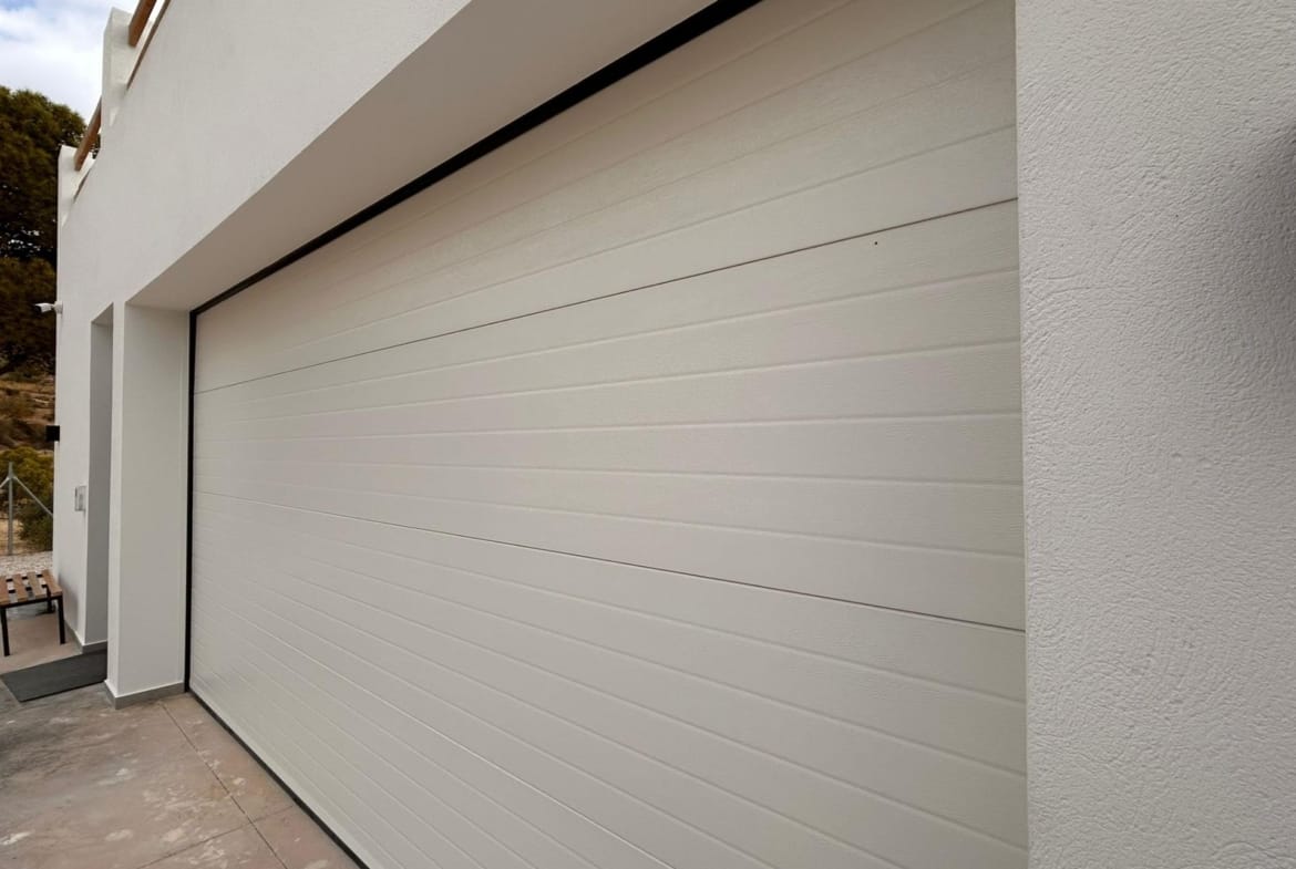 Sectional door of a closed villa garage in Pinoso, Alicante