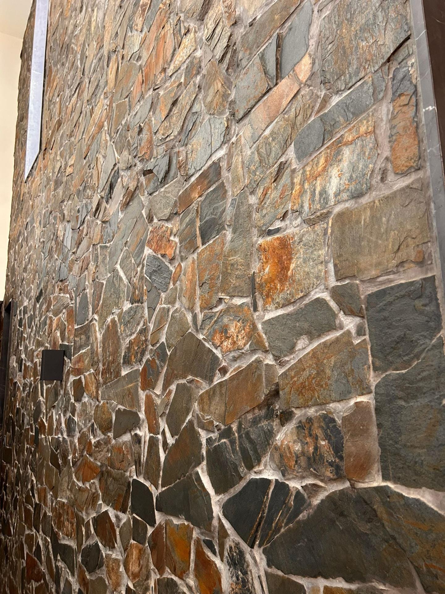 Custom-Built-New-Villas-in-Pinoso-Alicante-Spacious-Homes-in-Natural-Surroundings-41 Natural stone-clad wall beside the villa in Pinoso, Alicante