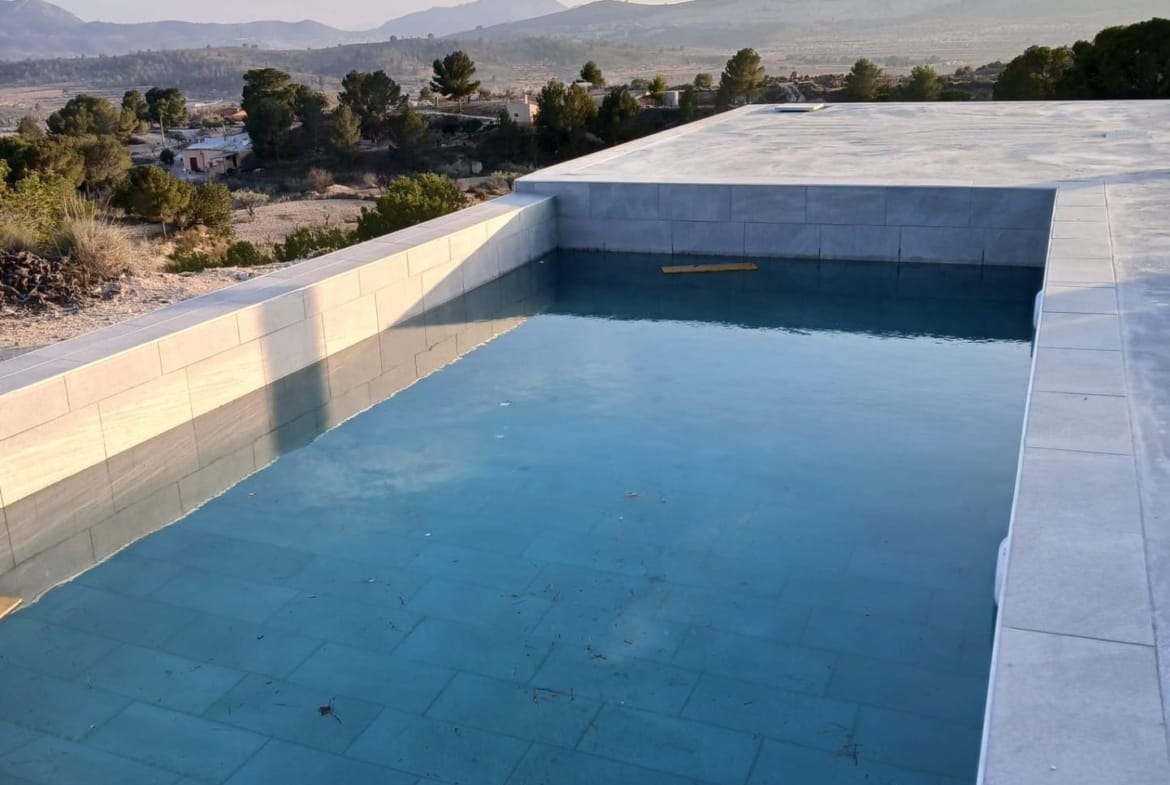 Private swimming pool beside an open countryside terrace in Pinoso, Alicante