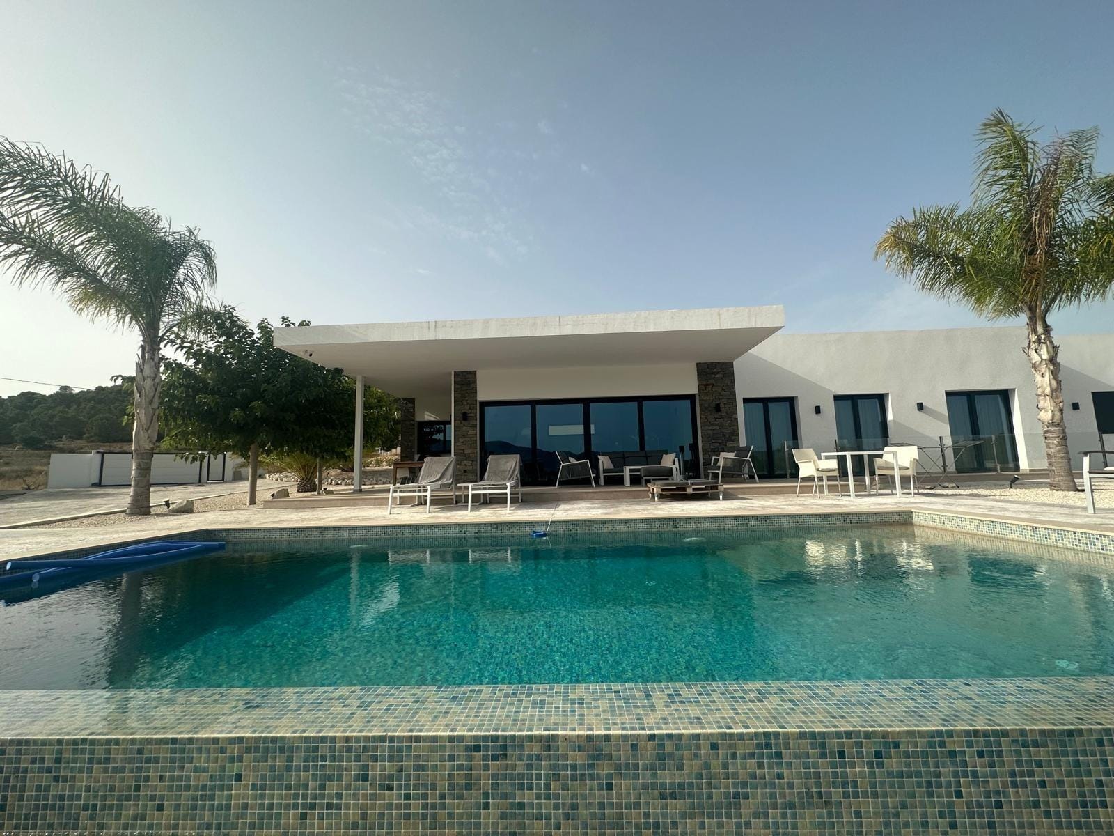 Custom-Built-New-Villas-in-Pinoso-Alicante-Spacious-Homes-in-Natural-Surroundings-9 Private pool and shaded terrace beside a villa in Pinoso, Alicante