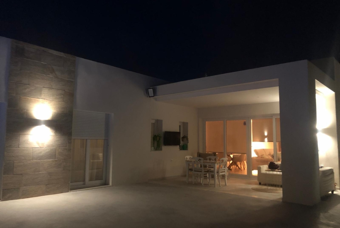 Illuminated covered terrace and living room at a Pinoso villa