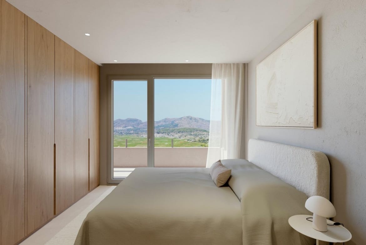 Double bedroom with fitted wardrobes and mountain-view terrace