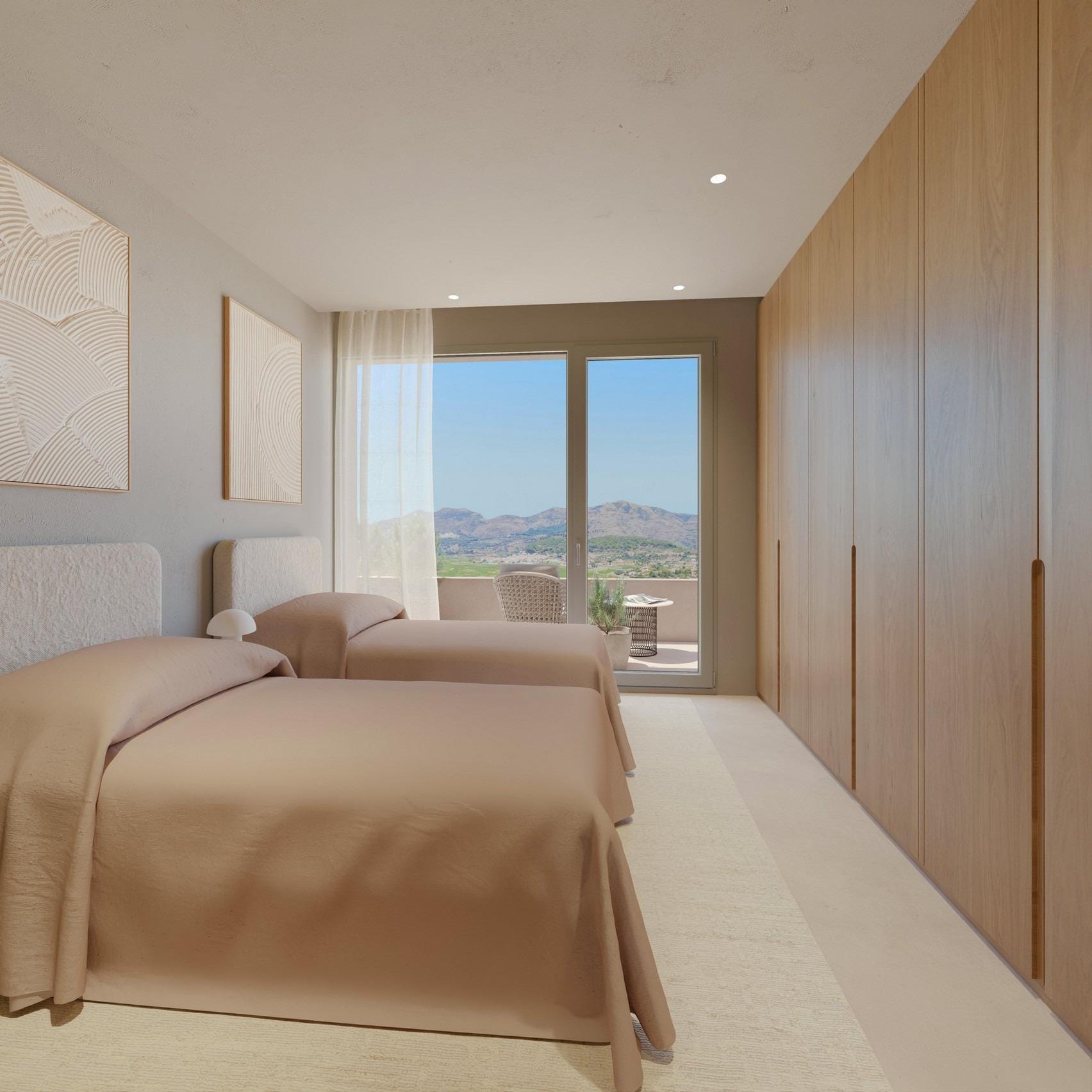 Twin bedroom with fitted wardrobes and private balcony