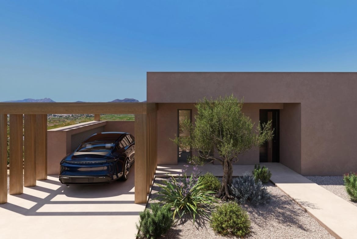 Covered private parking and entrance with Mediterranean garden