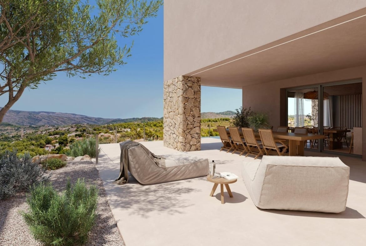 Covered outdoor lounge beside a Mediterranean garden and valley views