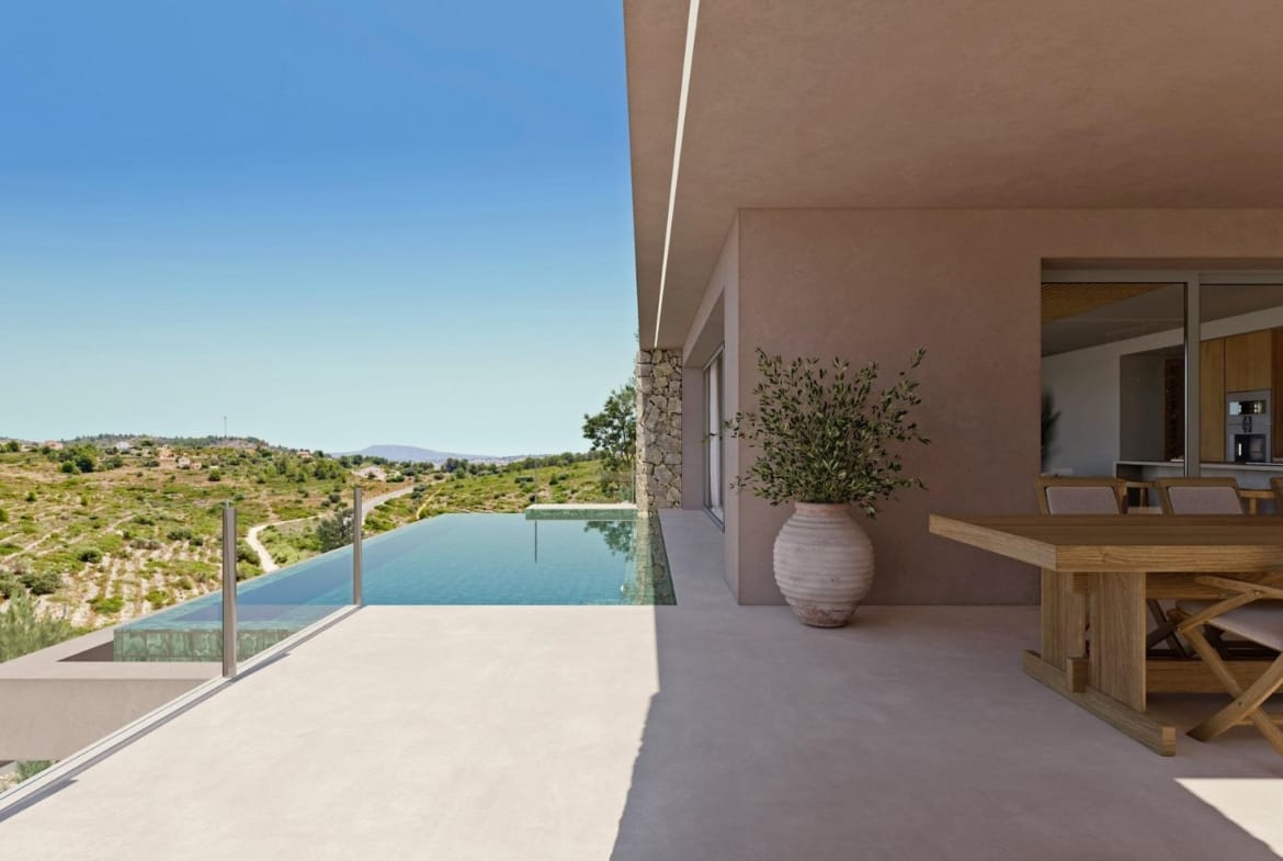 Infinity pool and covered dining terrace overlooking the Llíber hills