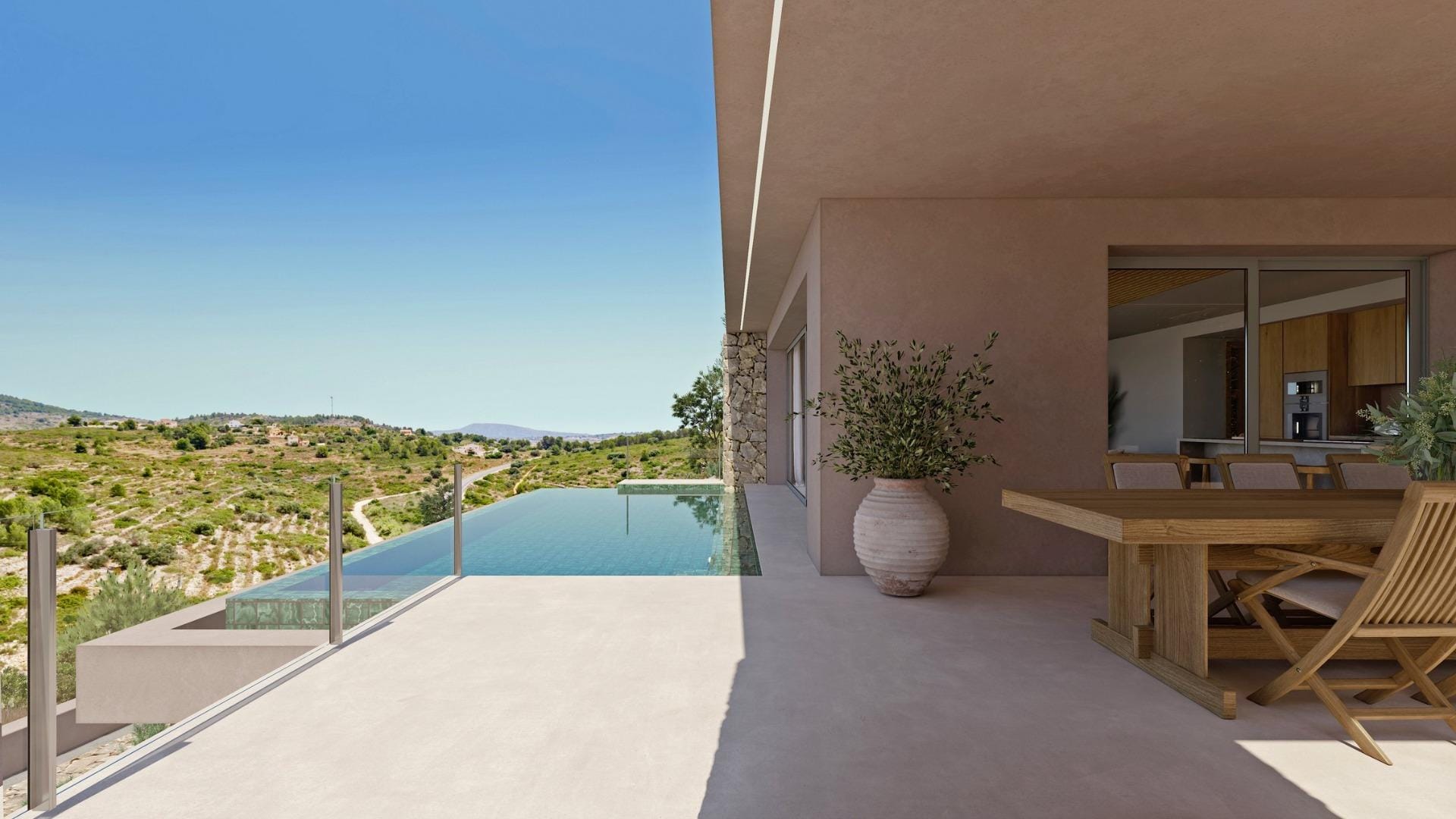Infinity pool and covered dining terrace overlooking the Llíber hills