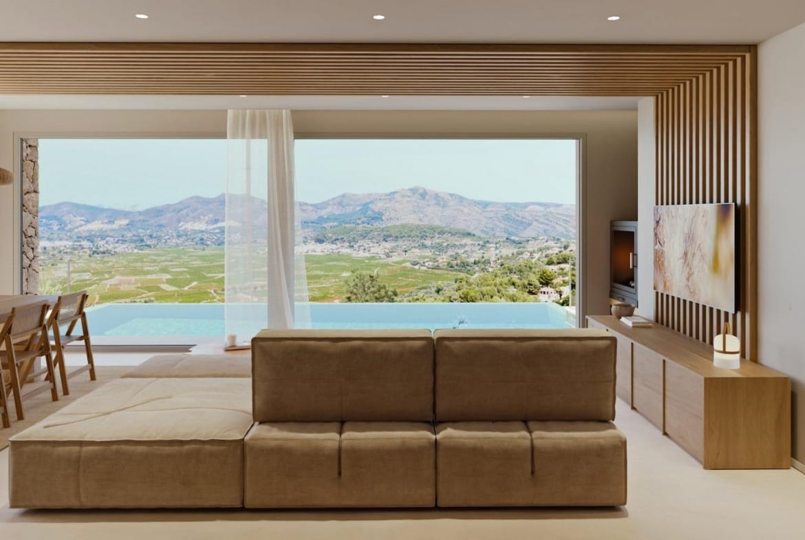 Living room facing the private pool and Vall de Pop landscape