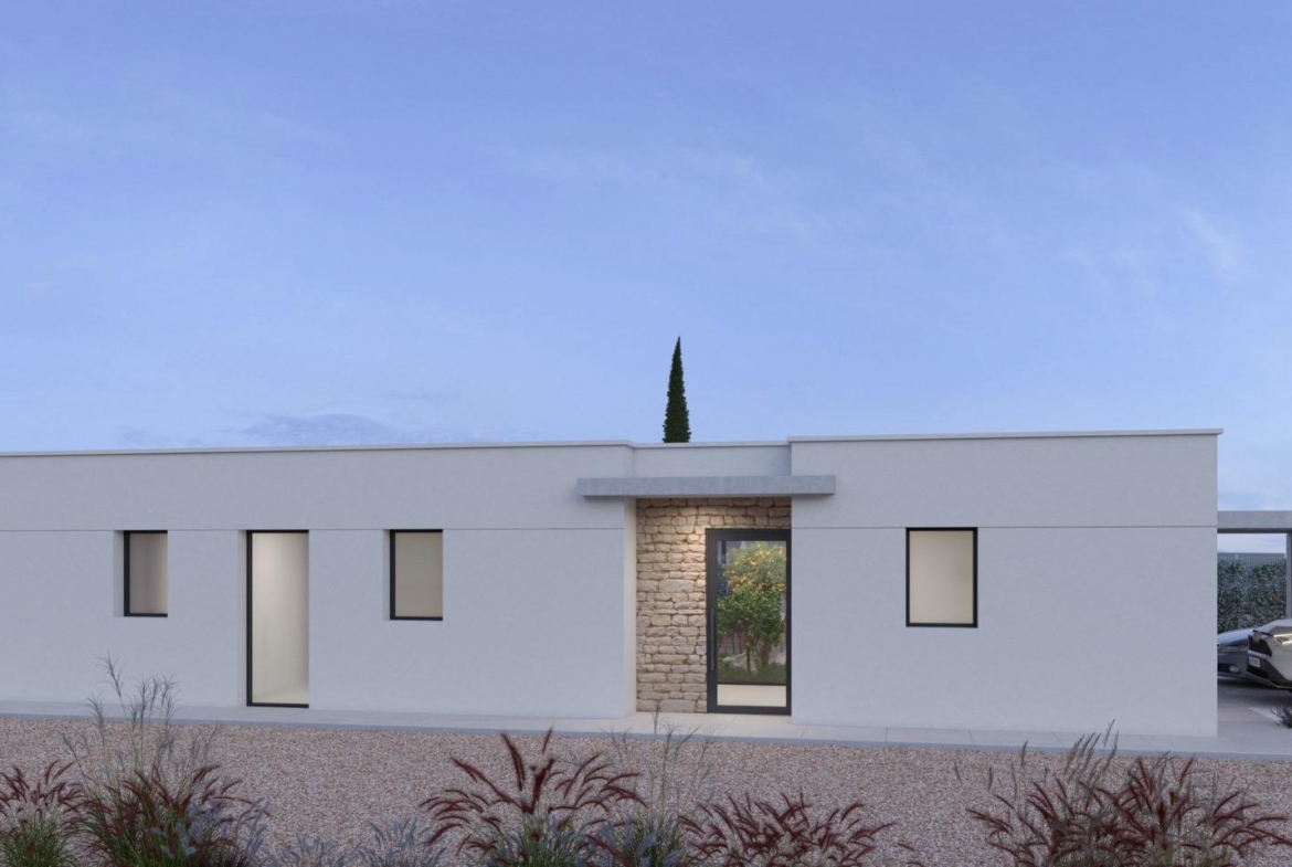 Modern single-storey villa exterior with pool, sun loungers and gravel landscaping