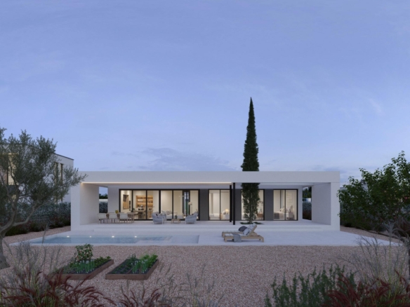 Single-storey modern villa rear with covered terrace, seating area and pool at dusk