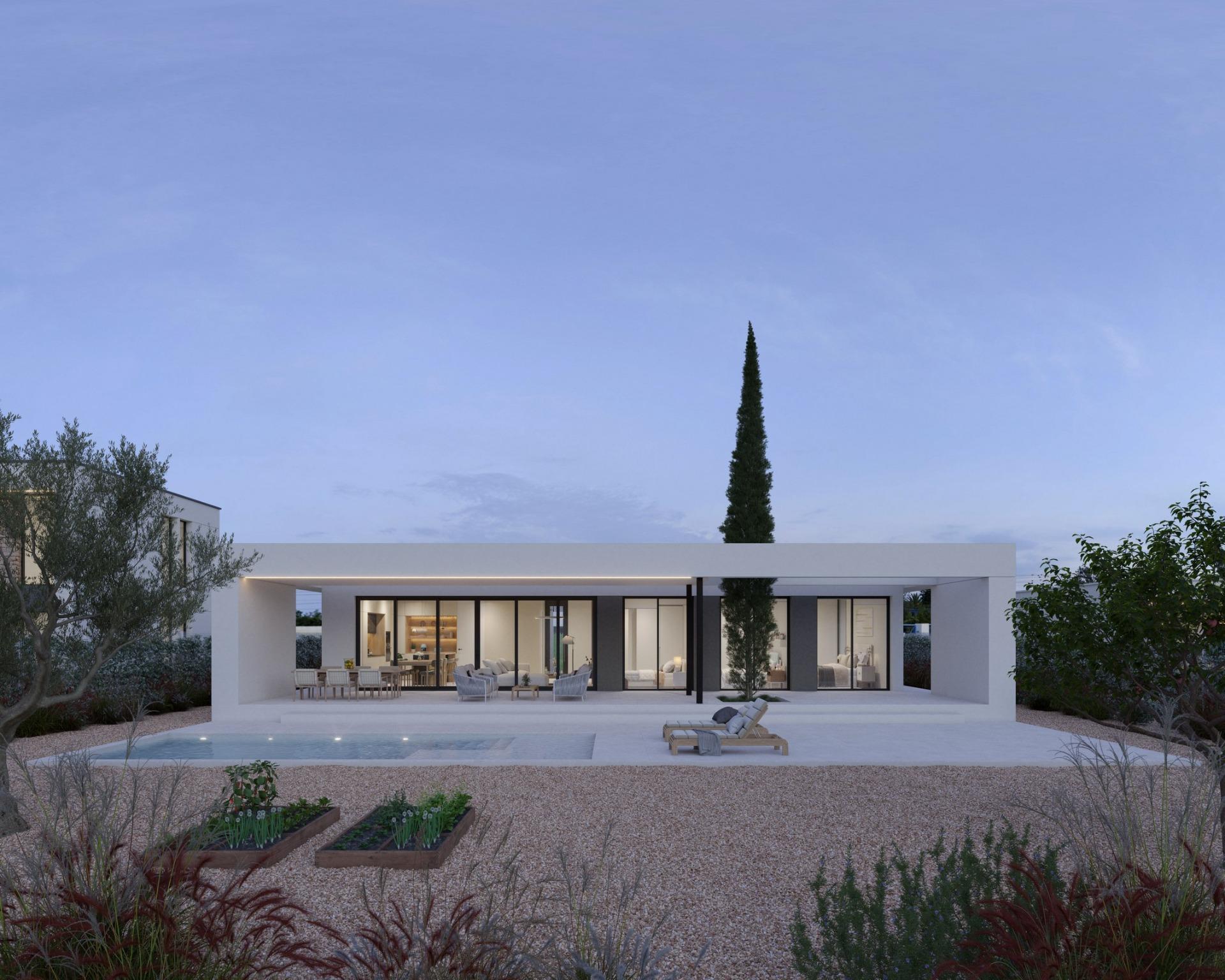 Single-storey modern villa rear with covered terrace, seating area and pool at dusk