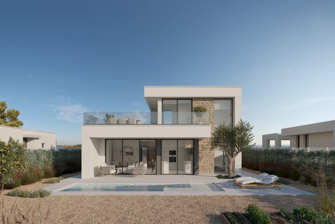 Front entrance view highlighting stone feature wall, glass doors and adjacent garage