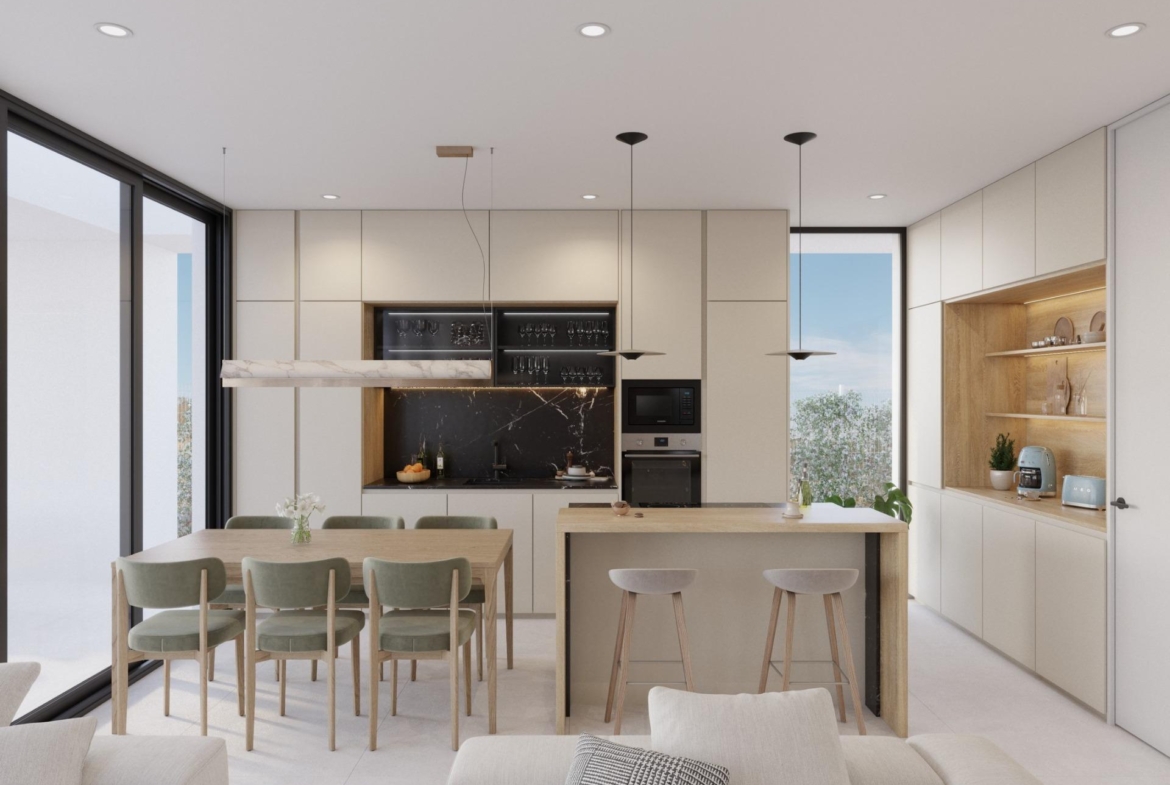 Contemporary kitchen island and dining area flowing into a bright living room