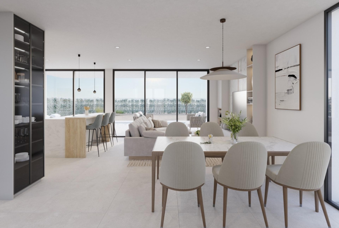 Open-plan living area with sofa, dining table and kitchen island with bar stools