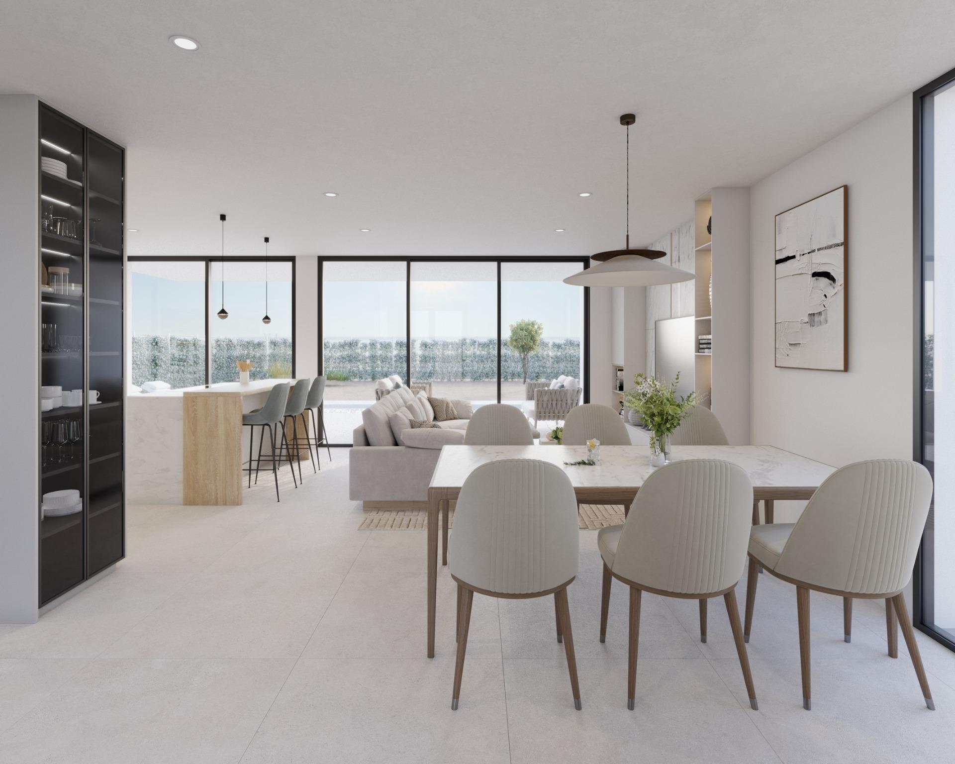 Open-plan living area with sofa, dining table and kitchen island with bar stools